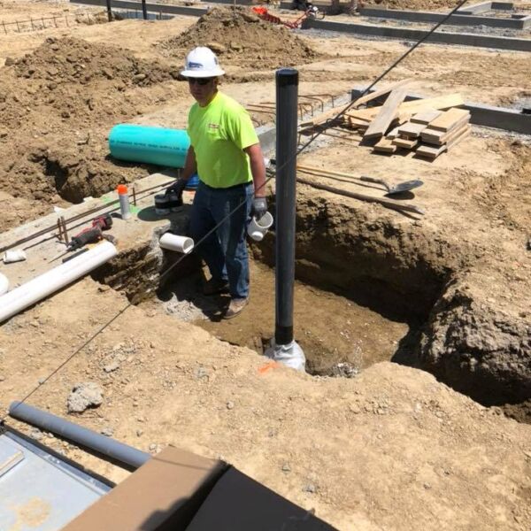 plumber working on new construction project